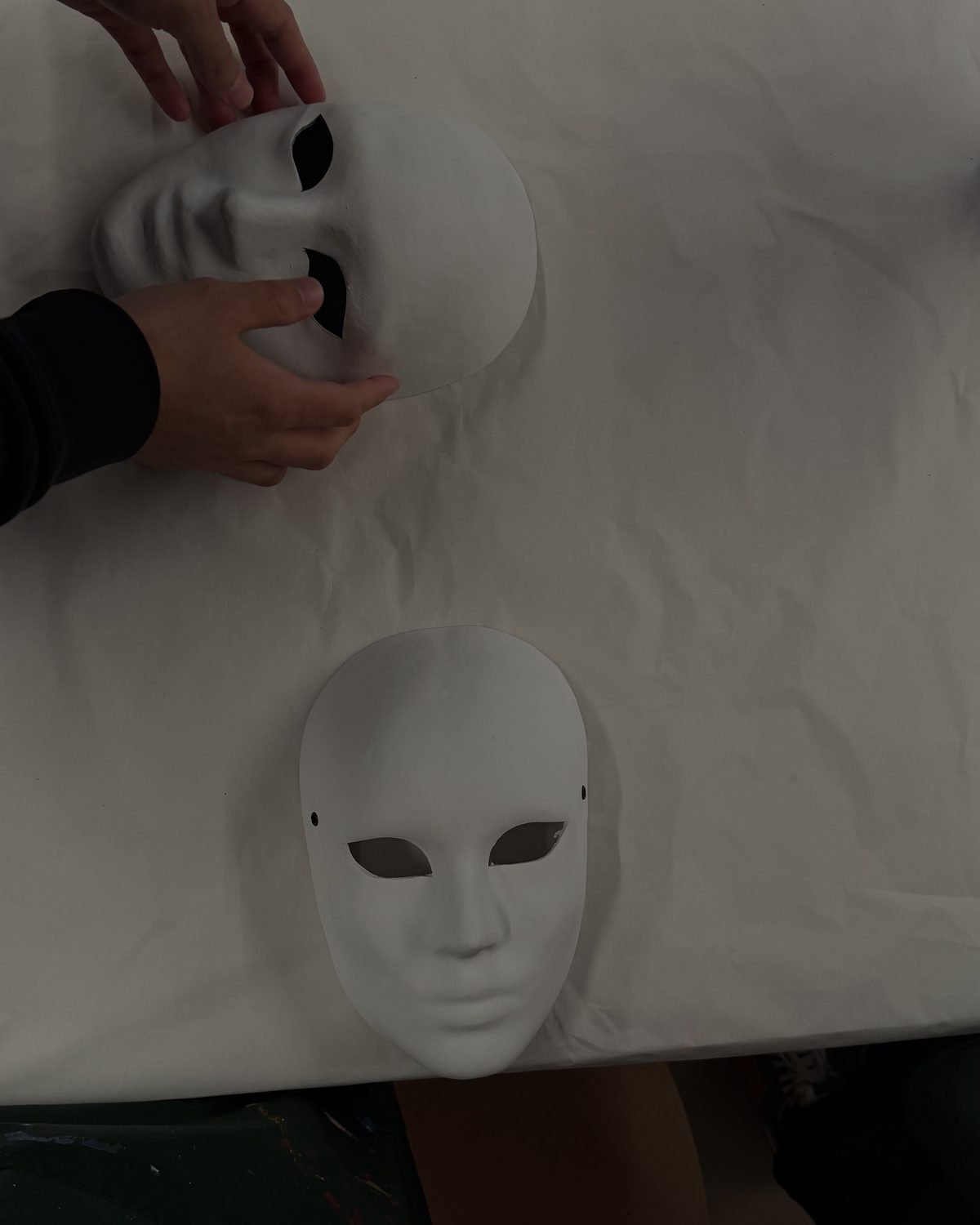 Where every mask starts — a plain white face, identical to the next.